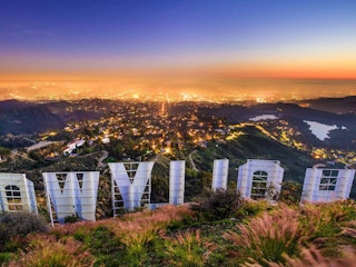 back of hollywood sign overlooking los angeles california at dusk