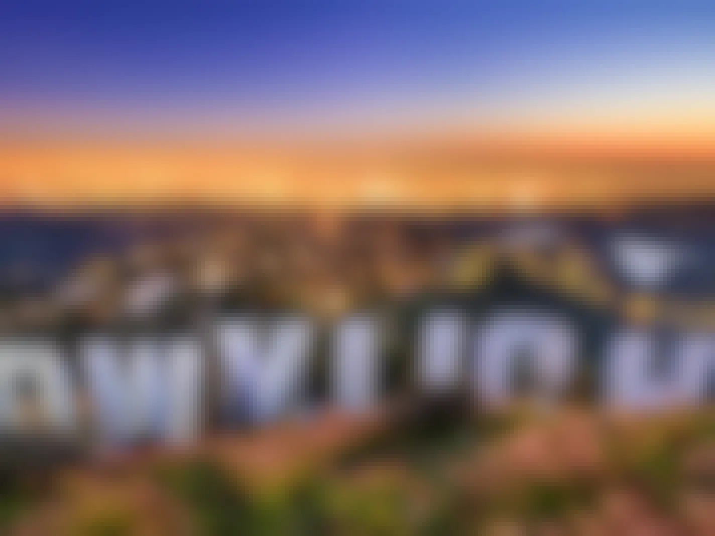 back of hollywood sign overlooking los angeles california at dusk