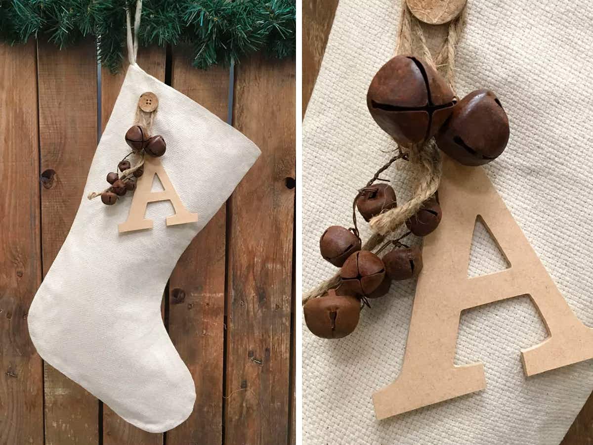 best christmas stockings - A Marilee Christmas Stocking with Letter Charm & Rusty Bells Ornament hanging on a mantel, and a close up on the letter charm and rusty bell ornaments