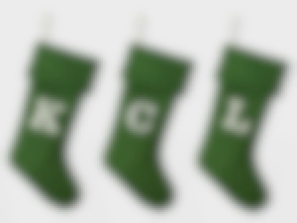 Three Wondershop Knit Monogram Christmas Stockings, each with a letter spelling out KCL