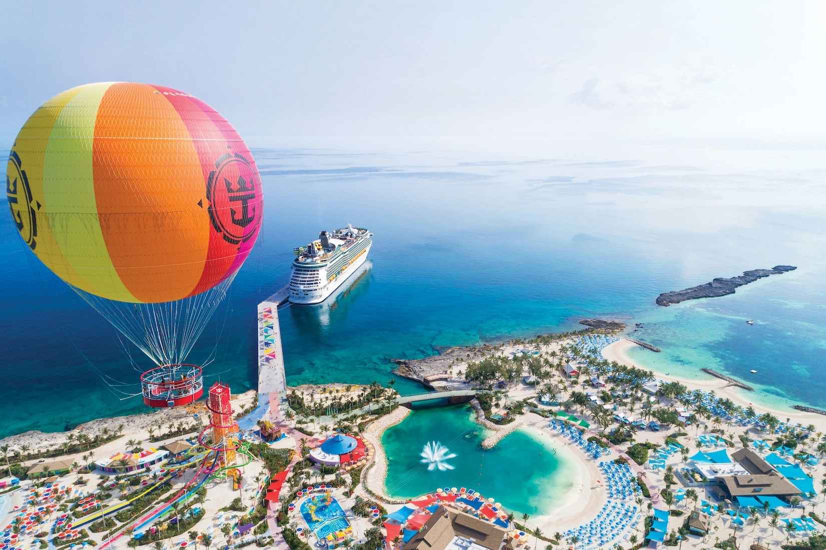 Aerial shot of coco cay with a hot air balloon in the foreground