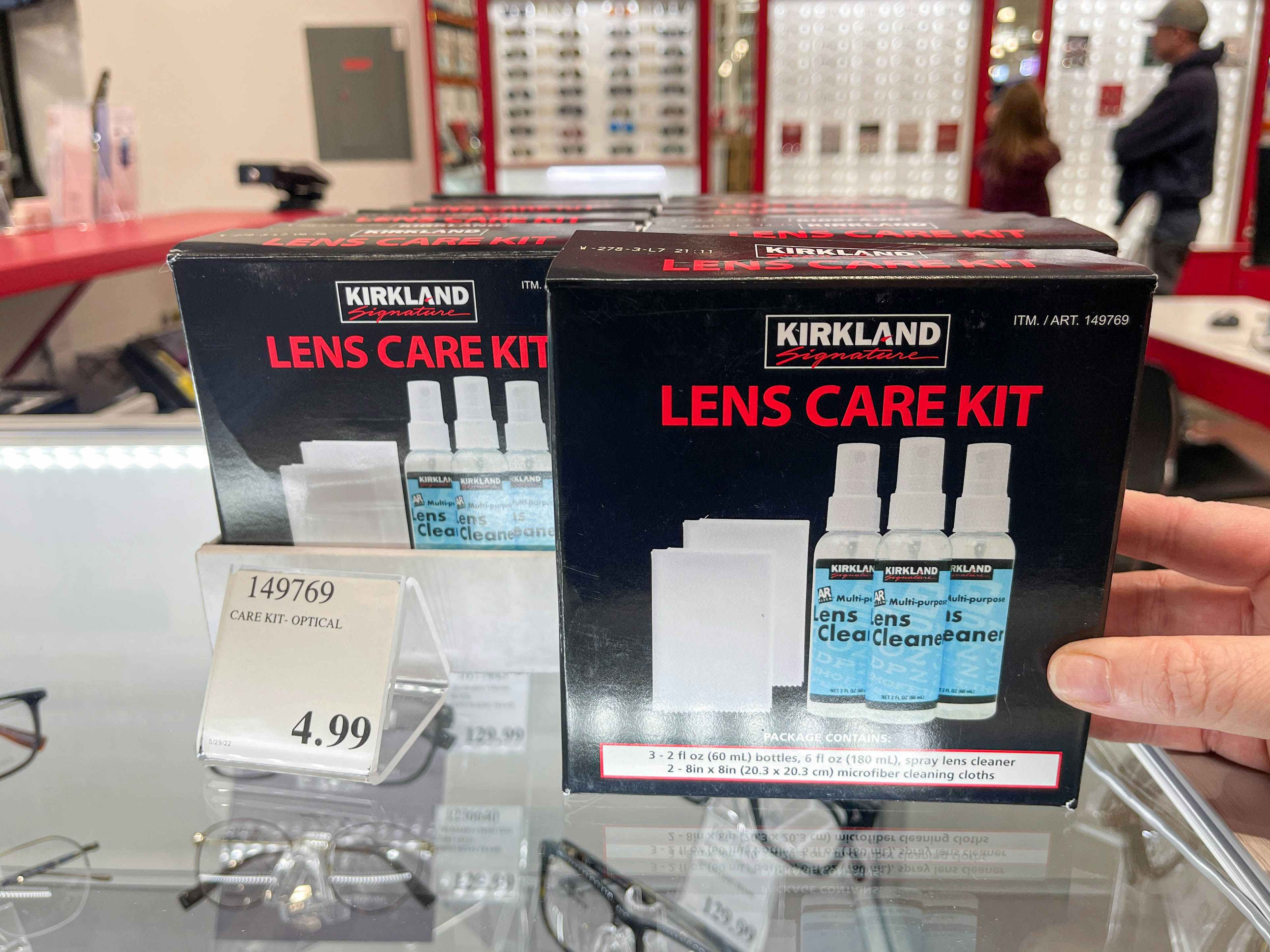 costco lens care kit being grabbed