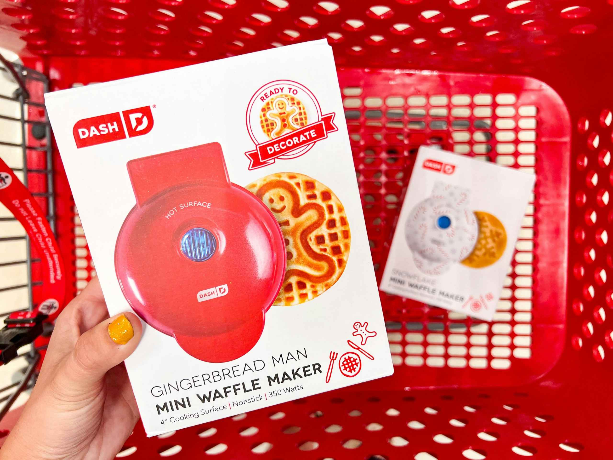 hand holding a dash gingerbread mini waffle maker over a target cart
