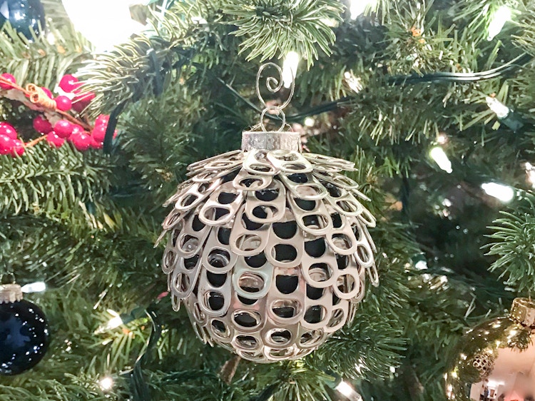 Ornament ball with pop can tabs glued on.