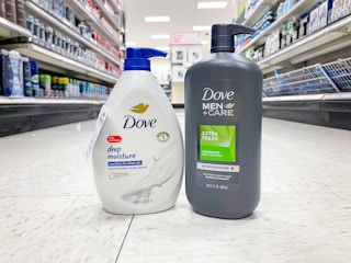 A bottle of Dove Deep Moisture and Dove men care sitting on the aisle floor.