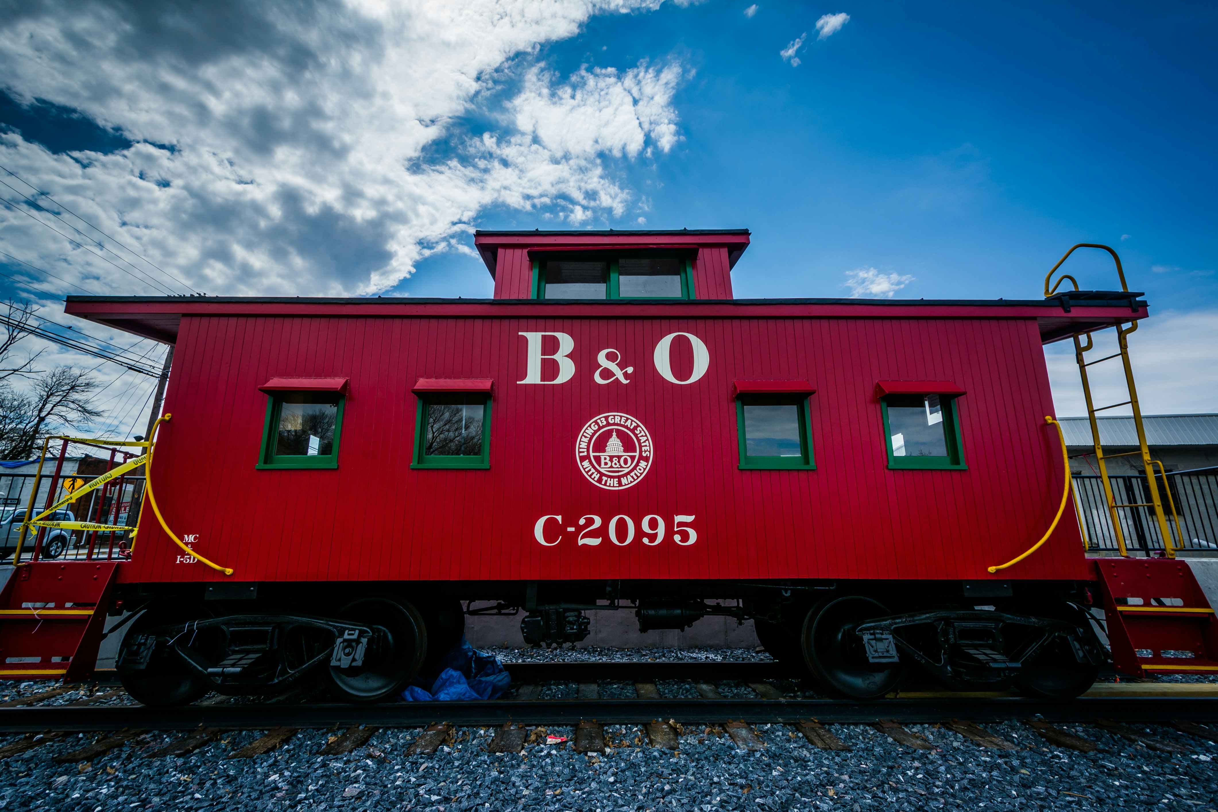 B and O Red Train Car against a clear blue sky