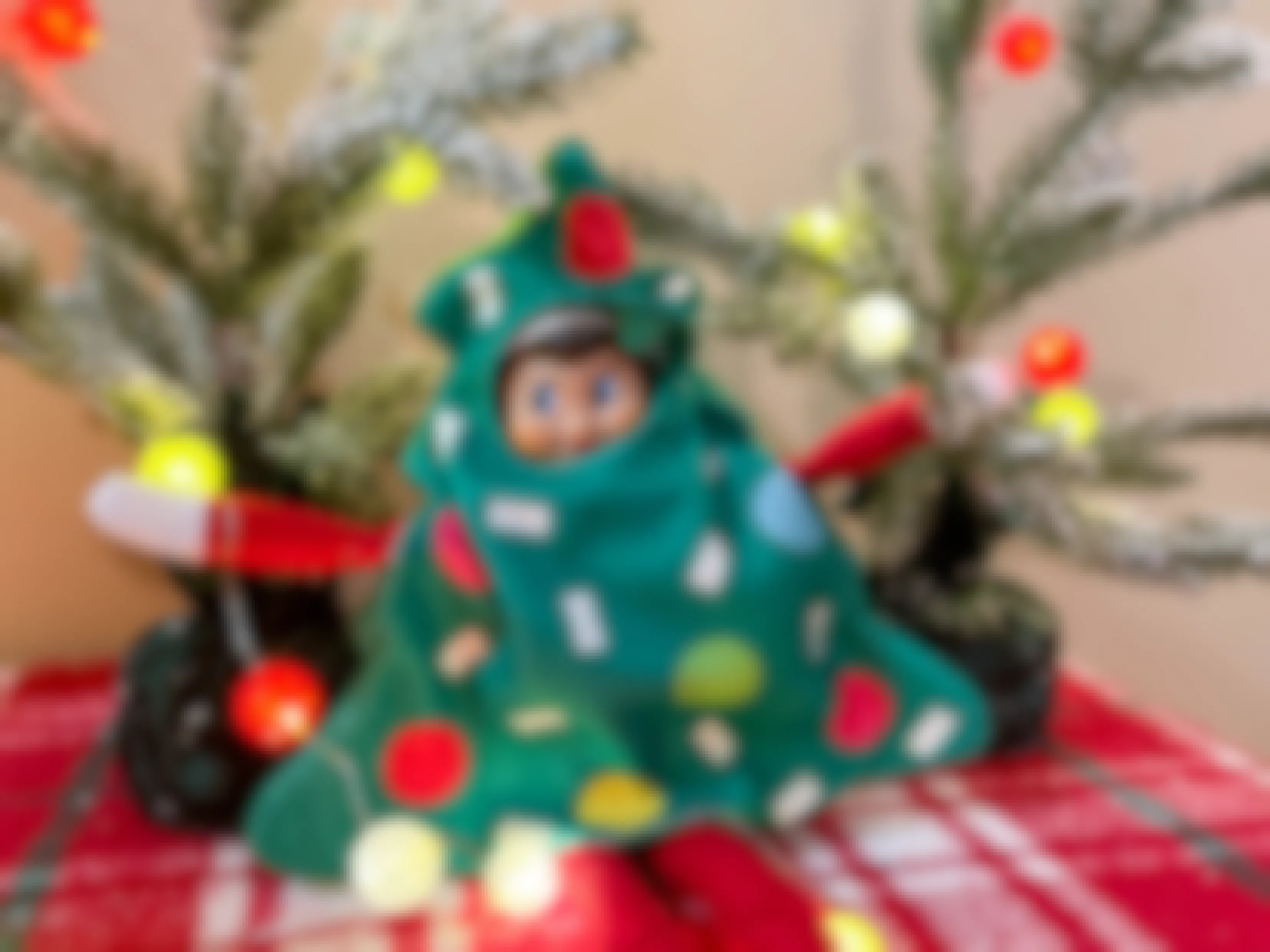 elf on the shelf doll in tree costume