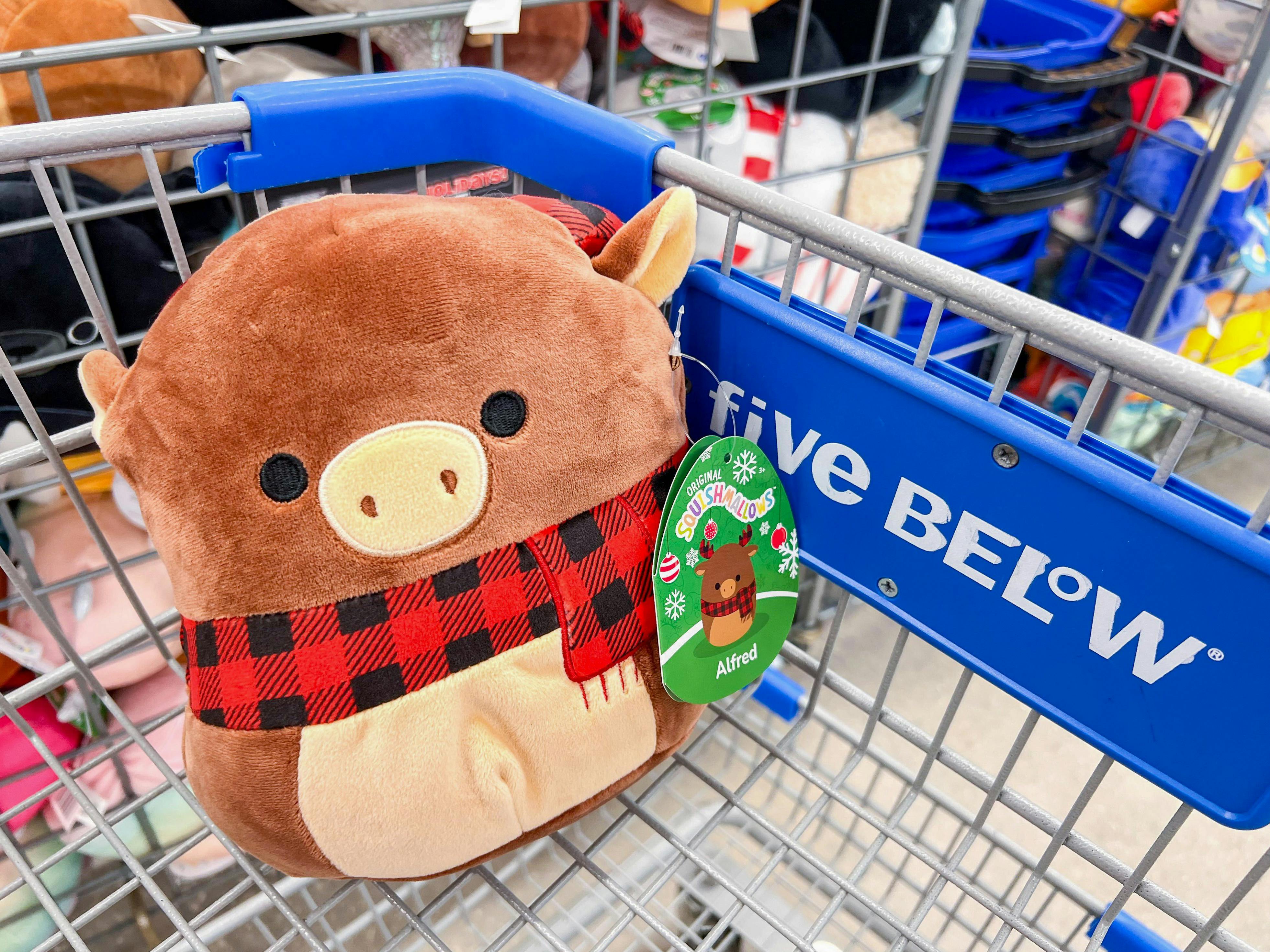 An Alfred Moose holiday Squishmallow in a Five Below cart
