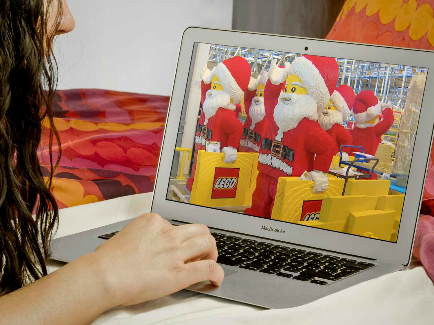 person streaming A Big Lego Christmas movie on laptop