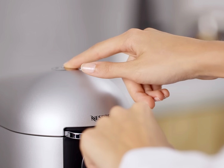 running a cycle of water through nespresso machine for cleaning