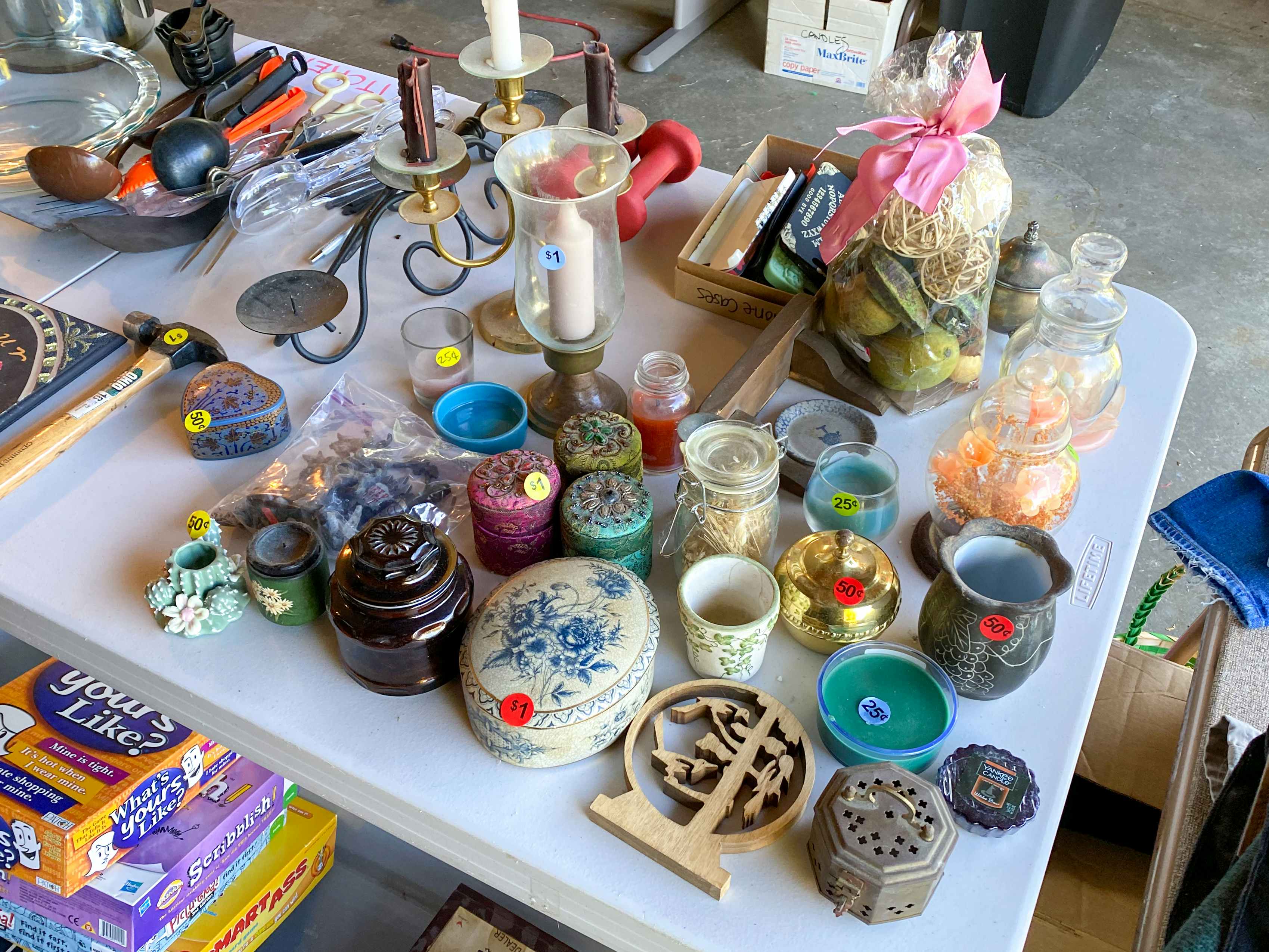 A table of knick-knacks in a garage sale