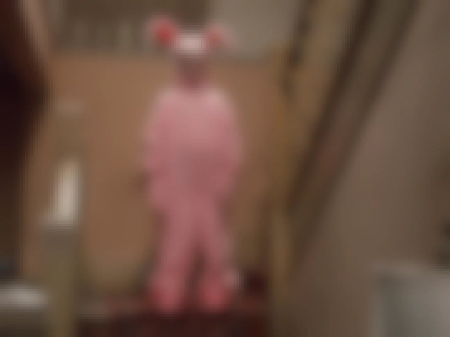 A screencap from the 1983 movie A Christmas Story with the main character Ralphie in his bunny suit 
