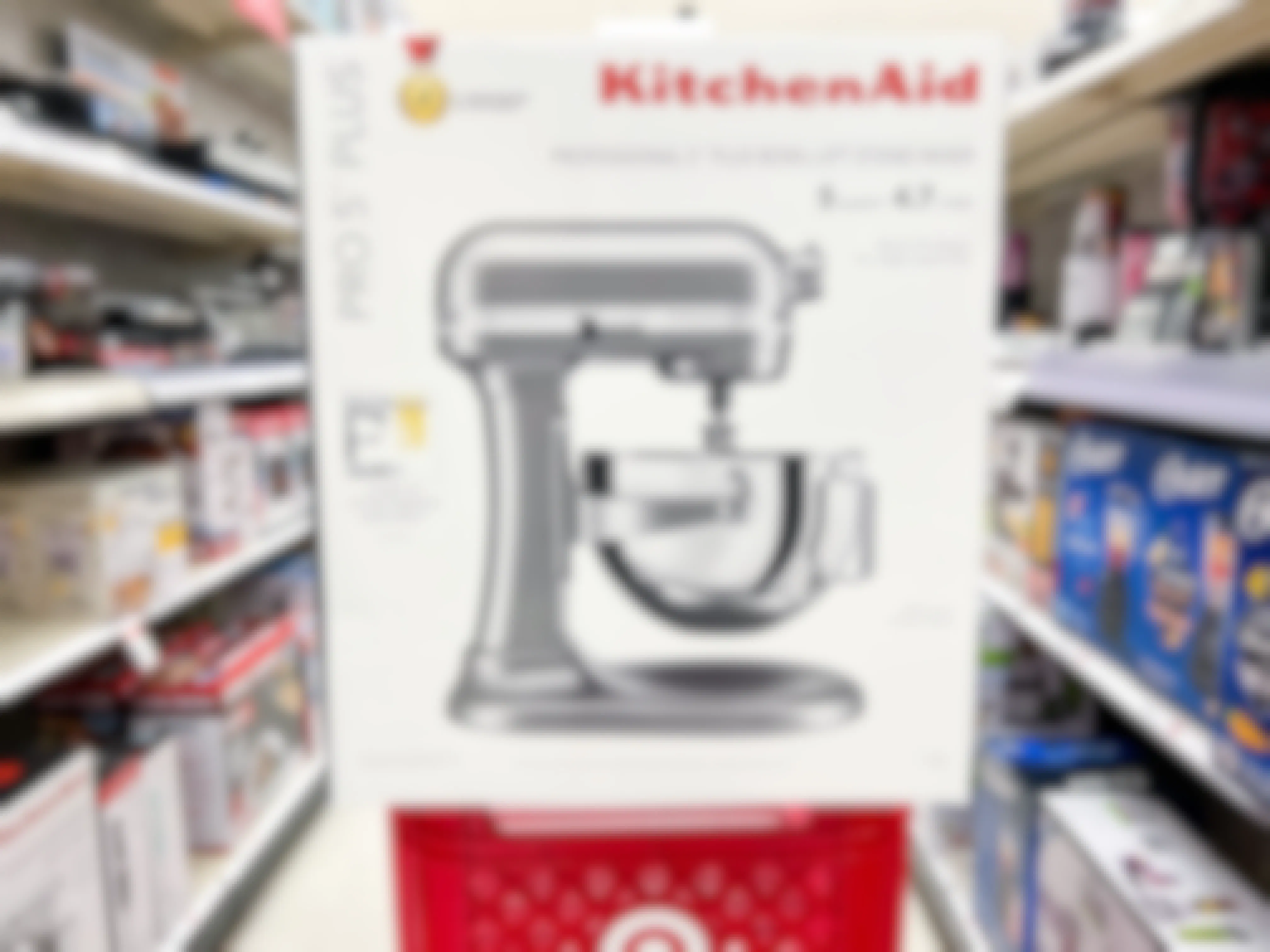 a kitchenaid 5-quart pro stand mixer in silver in a target shopping cart