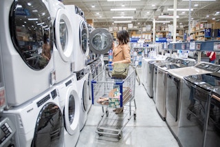 someone looking at large appliances at Lowe's