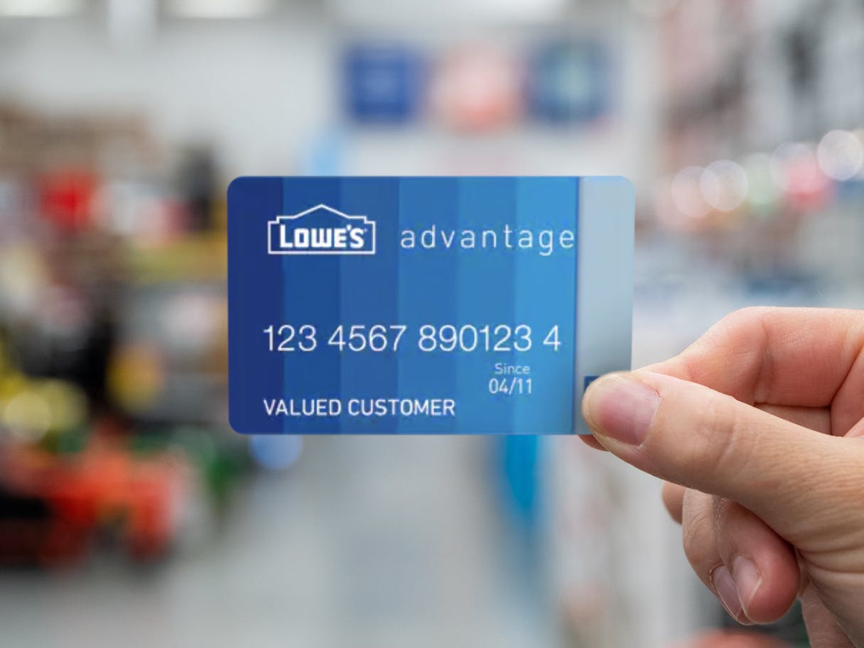 hand holding lowes advantage credit card in store