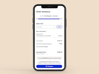 a phone showing the online checkout process with a free shipping promo code entered