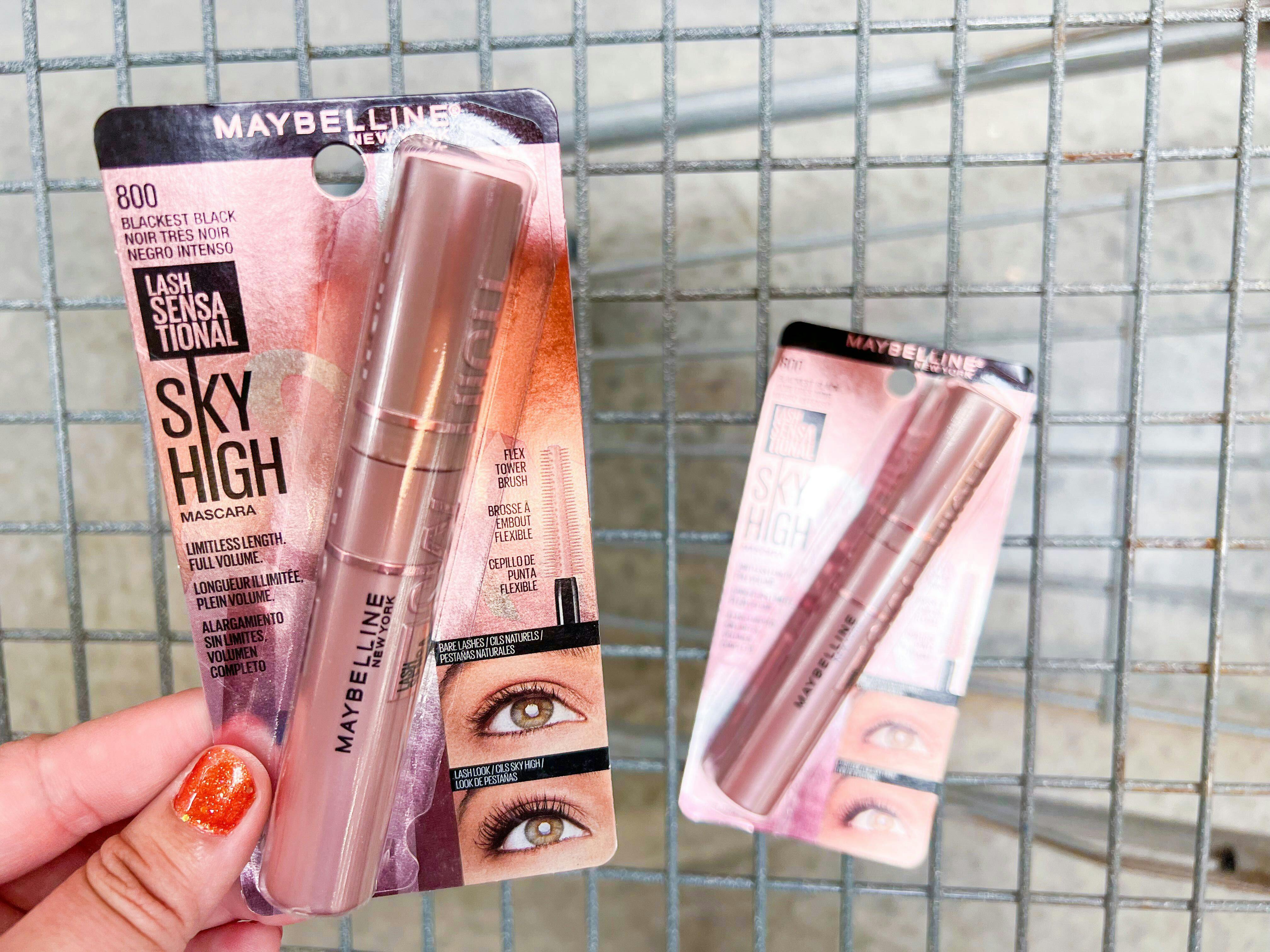 Hand holding two packs of Maybelline Sky High mascara