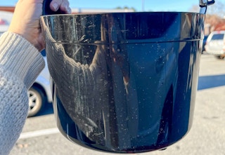 someone holding a cauldron