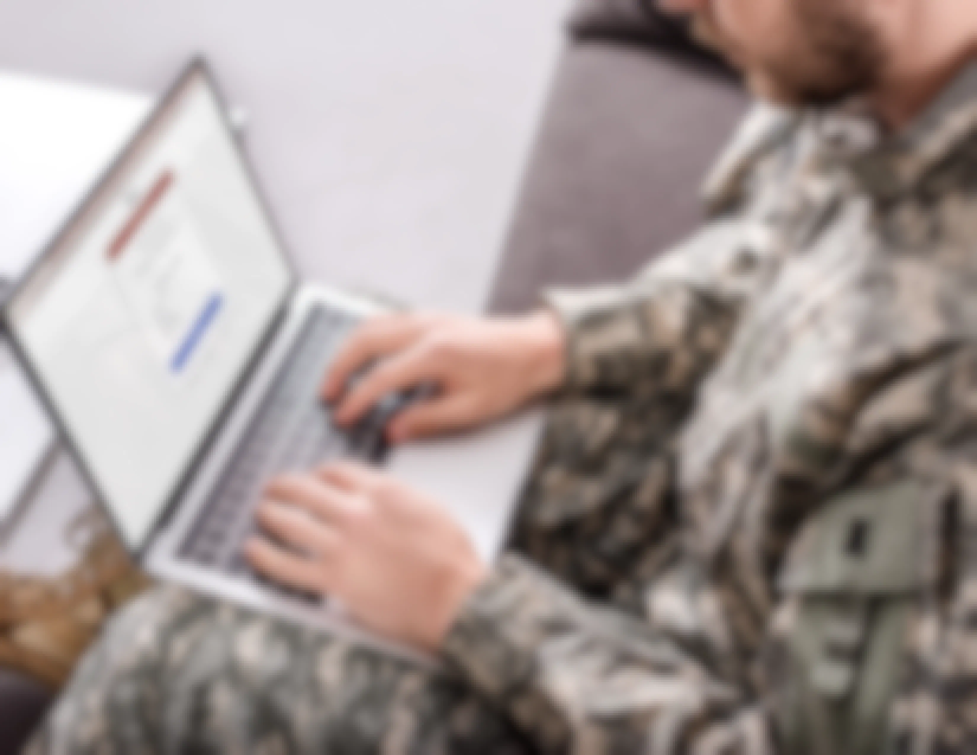 man in the military on laptop looking at id me website