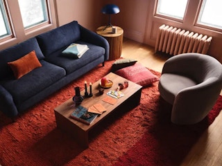 chari and sofa sitting on a red carpet