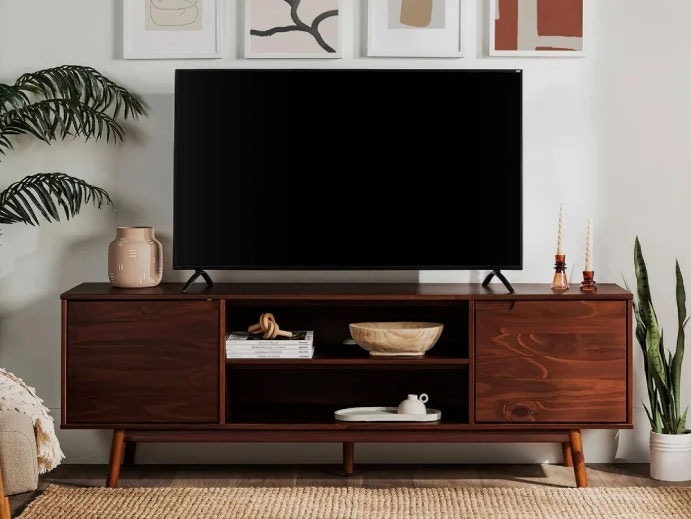 Tv on a dark wood media console