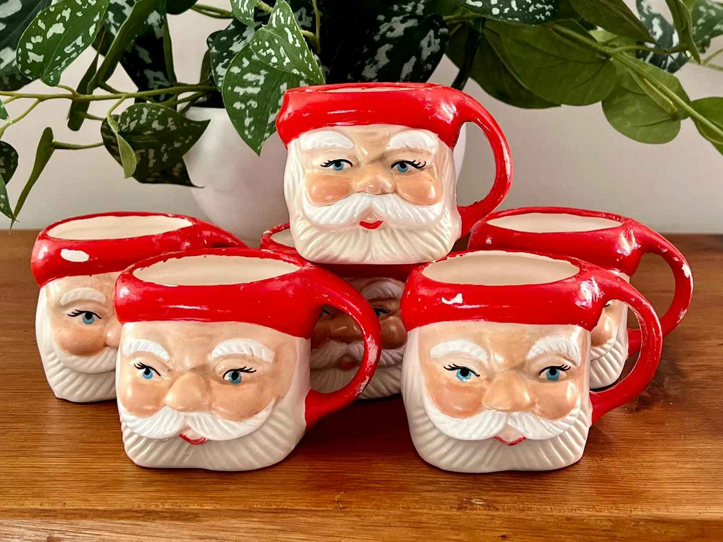 vintage santa mugs - A collection of Vintage Hand-Painted Santa Mugs on a table