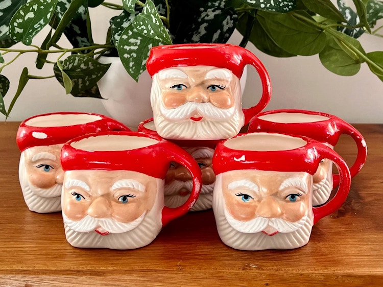 vintage santa mugs - A collection of Vintage Hand-Painted Santa Mugs on a table