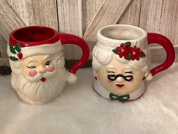 vintage santa mugs - A Lang Mr. & Mrs. Santa Mug Set on a soft surface against a wooden wall