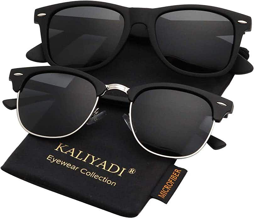 Two different styles of sunglasses sitting on a cloth bag
