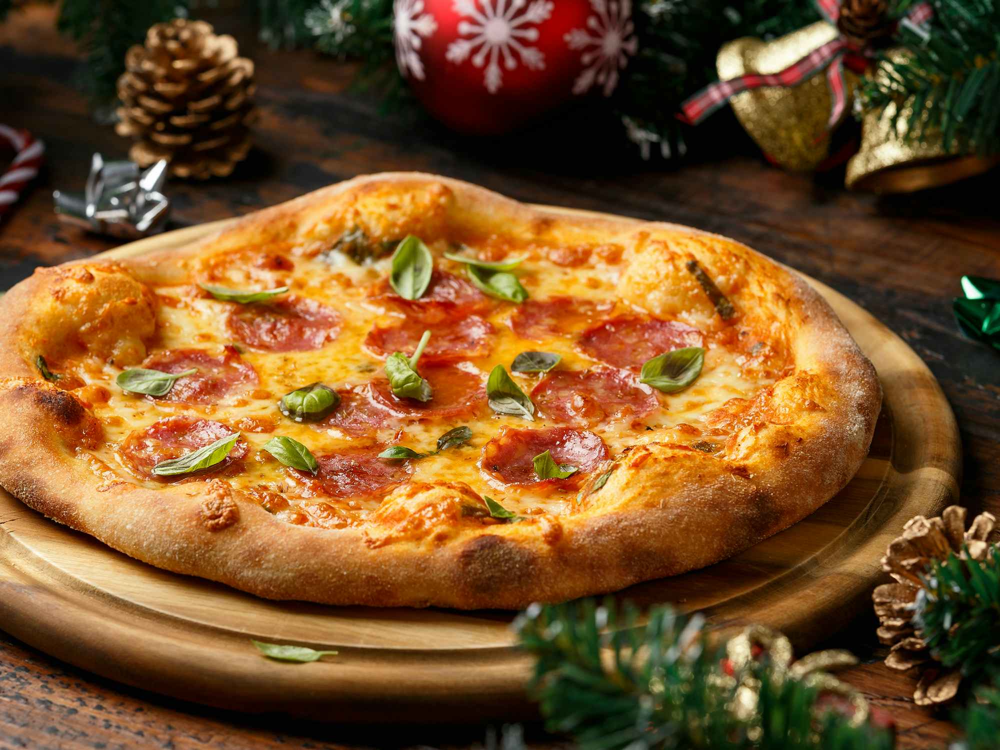 pizza on stone with christmas holiday decor feature