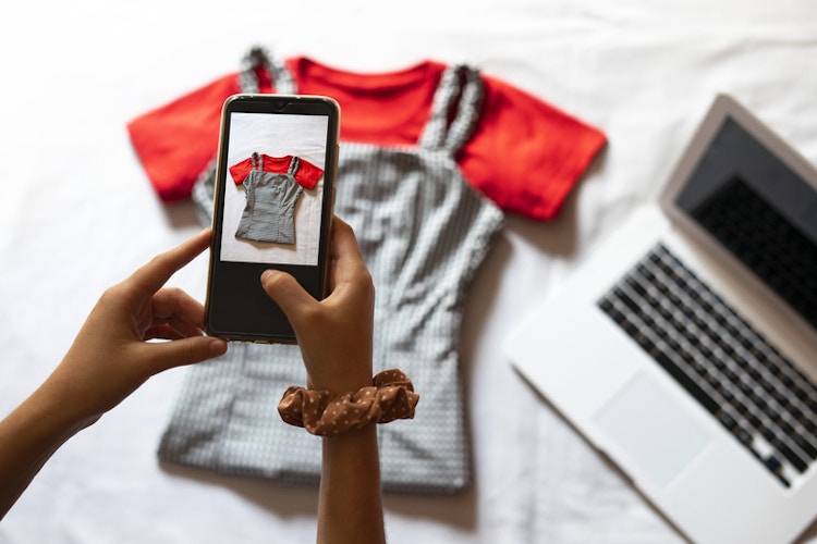 a person taking photos of an outfit 