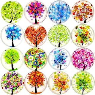 Some colorful floral magnets on a white background