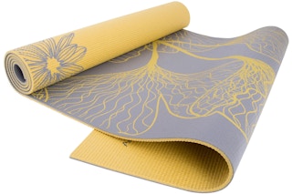 secret santa gifts - a yellow and grey reversible yoga mat with flower patterns