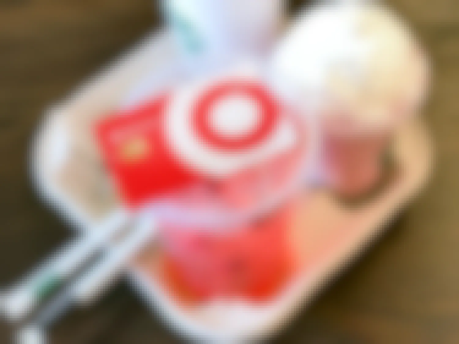 target red card sitting on starbucks refreshers drinks