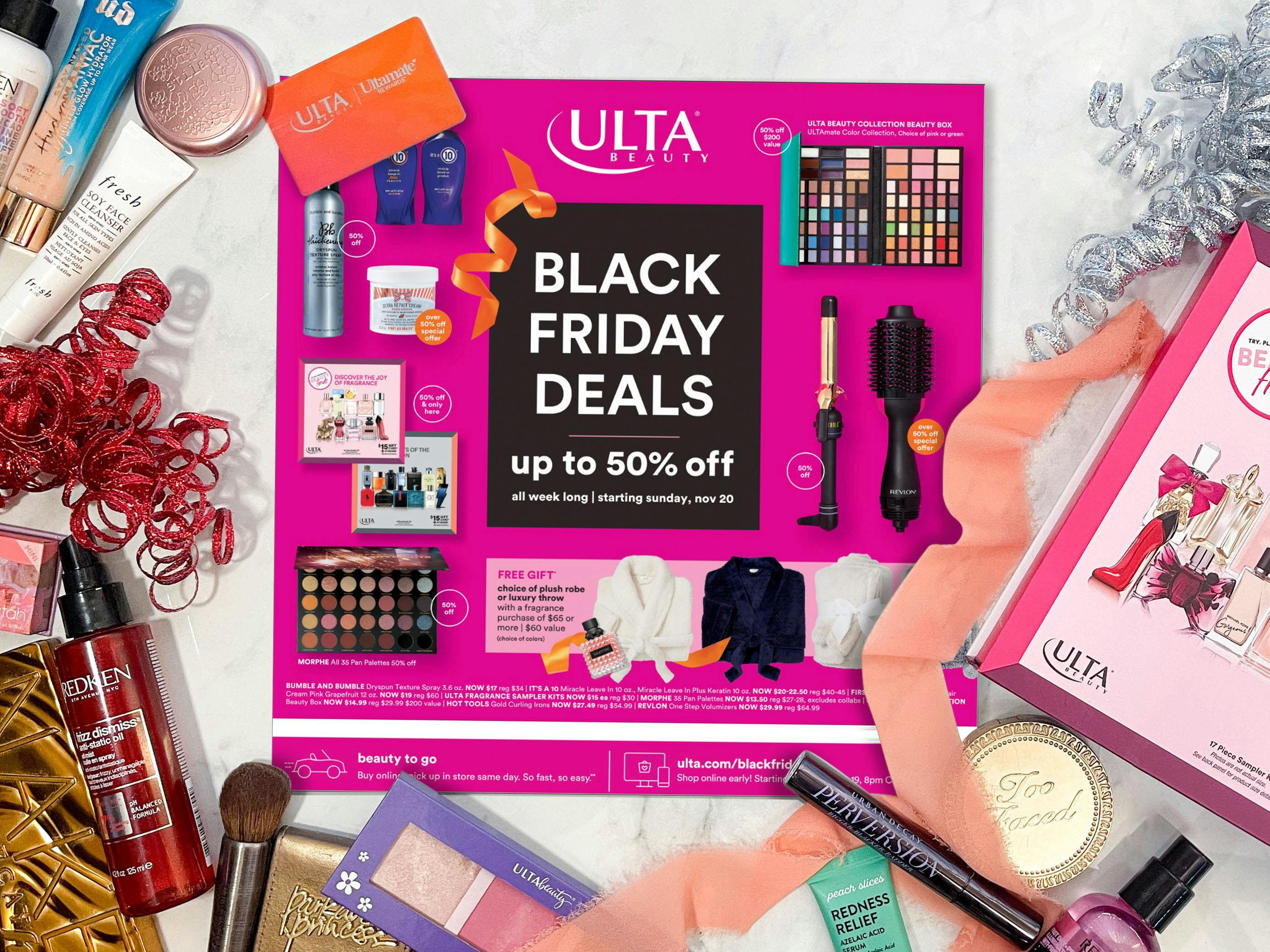 The Ulta Black Friday 2022 advertisement on a table with beauty products and ribbons