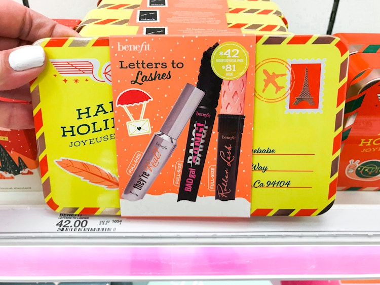 Someone taking a Benefit Letters to Lashes Ulta gift set from a shelf at Target