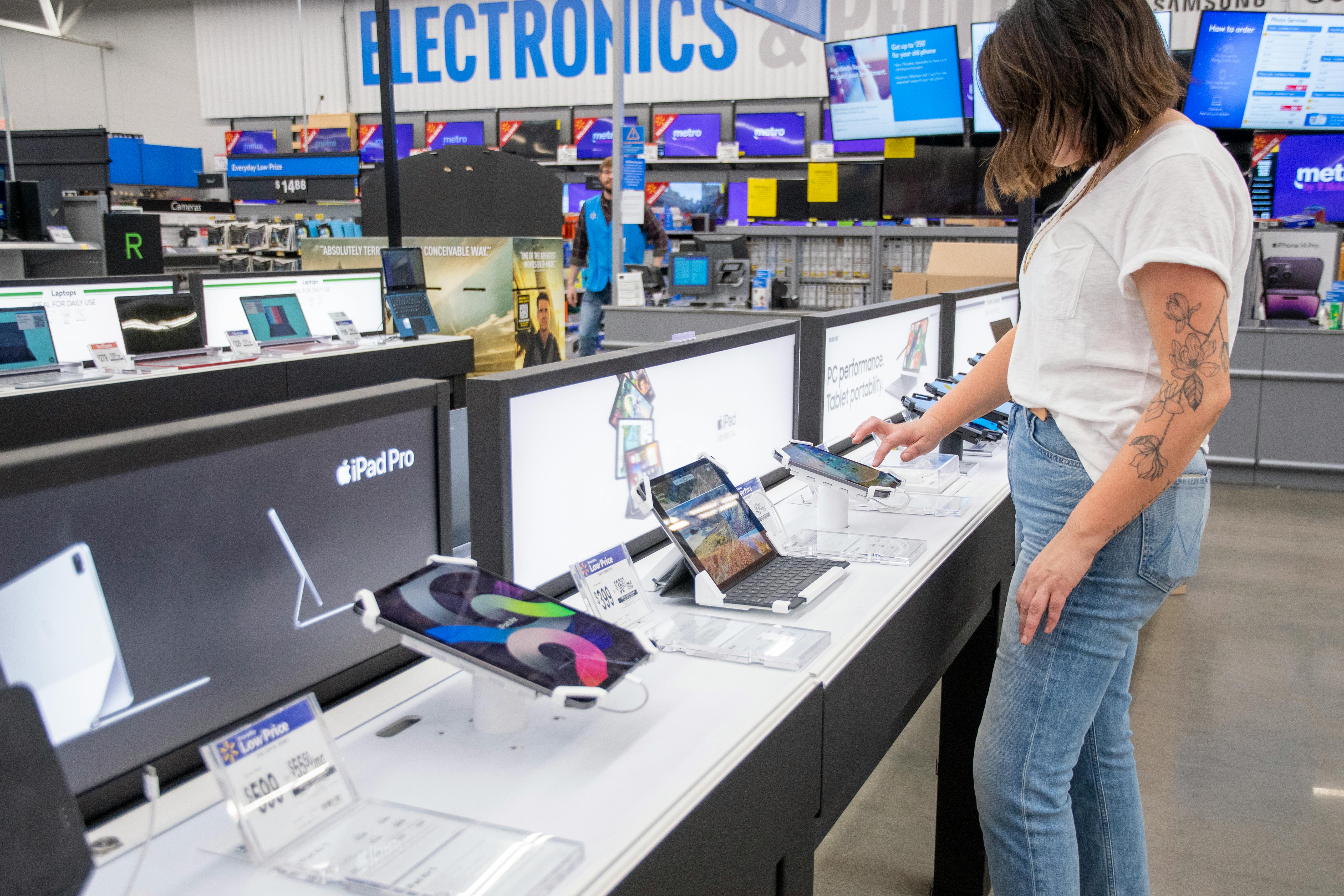 person shopping in electronics aisle at target