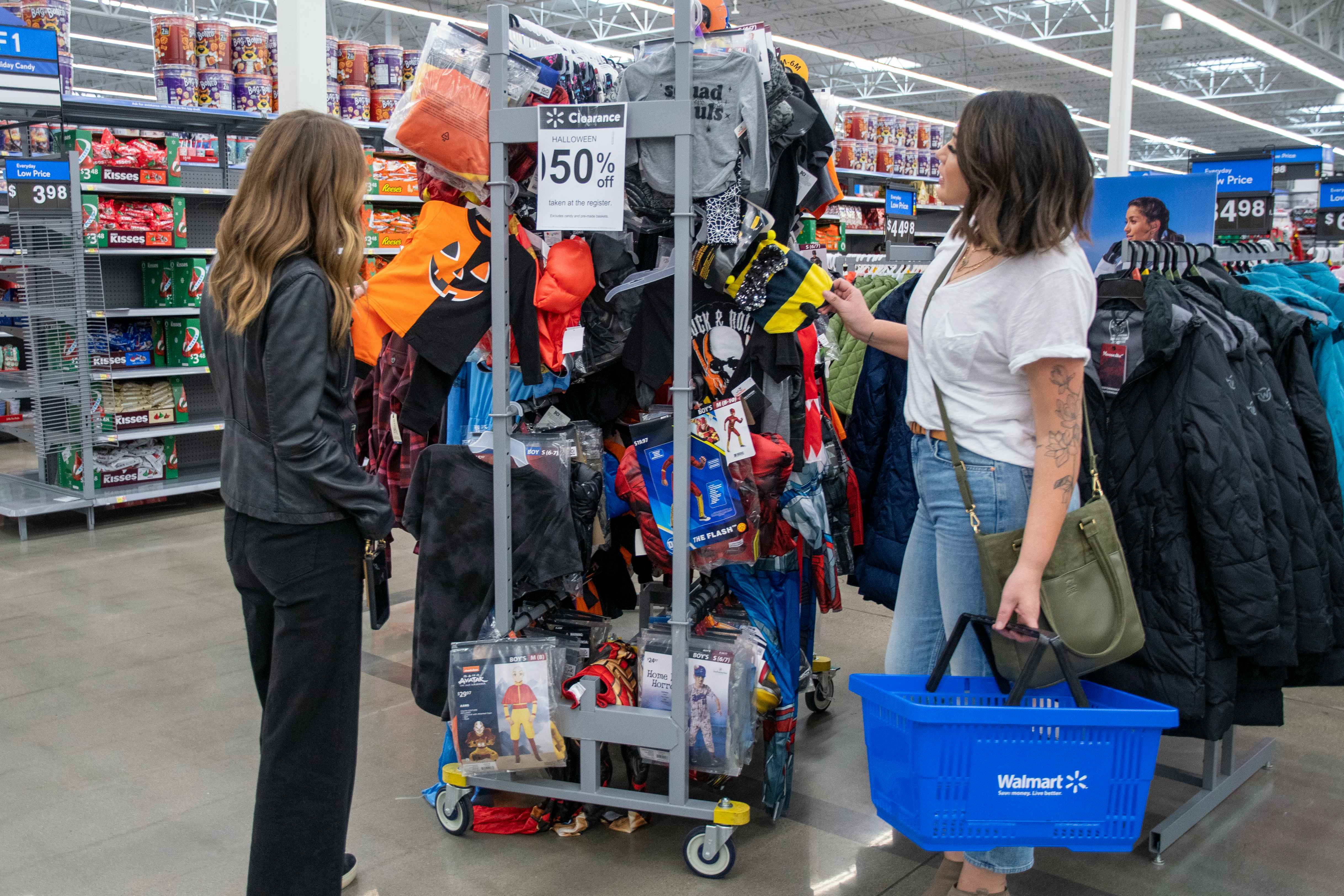 Women looking at Halloween Clearance in Walmart