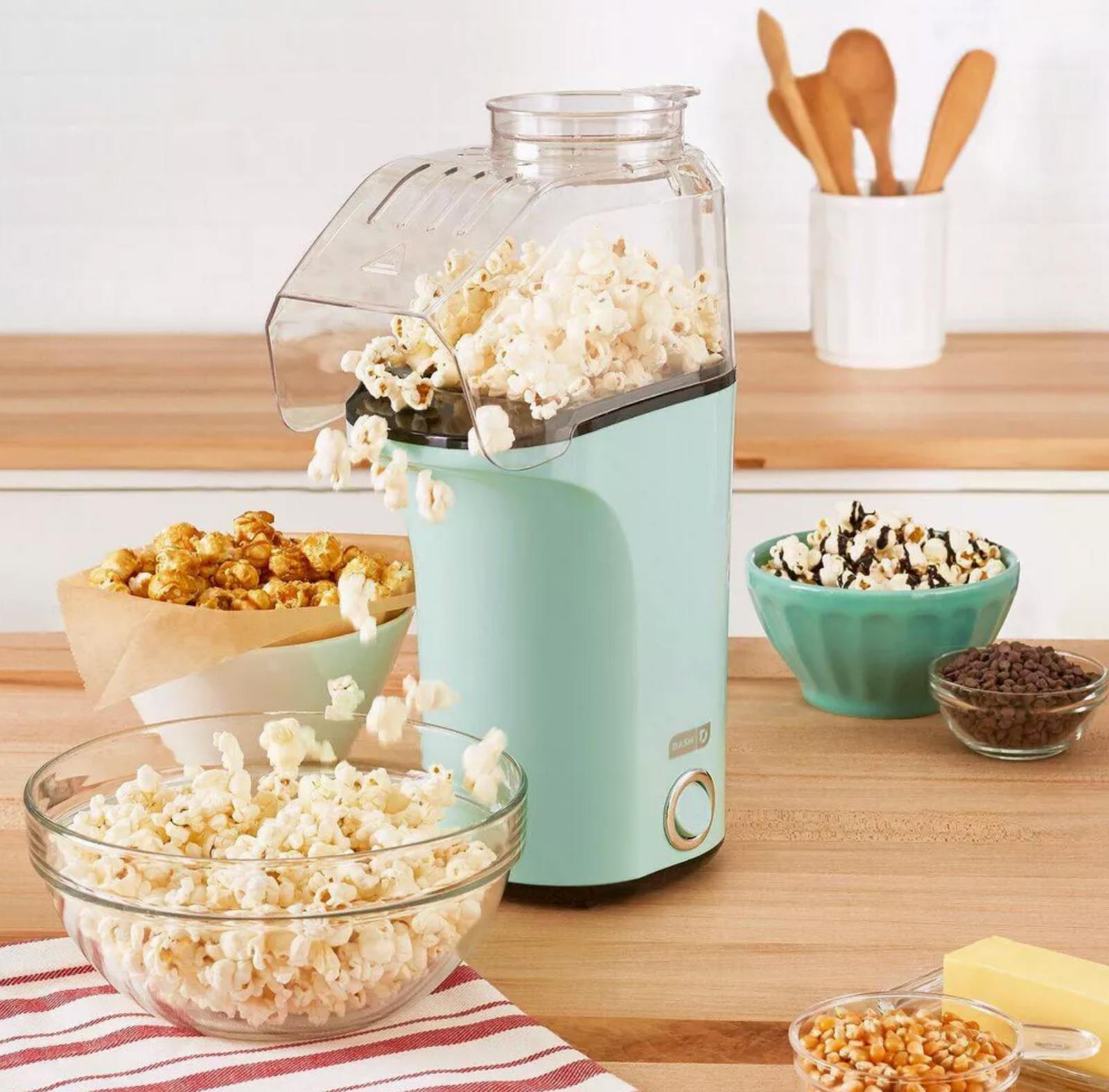 dash popcorn maker making popcorn on a counter