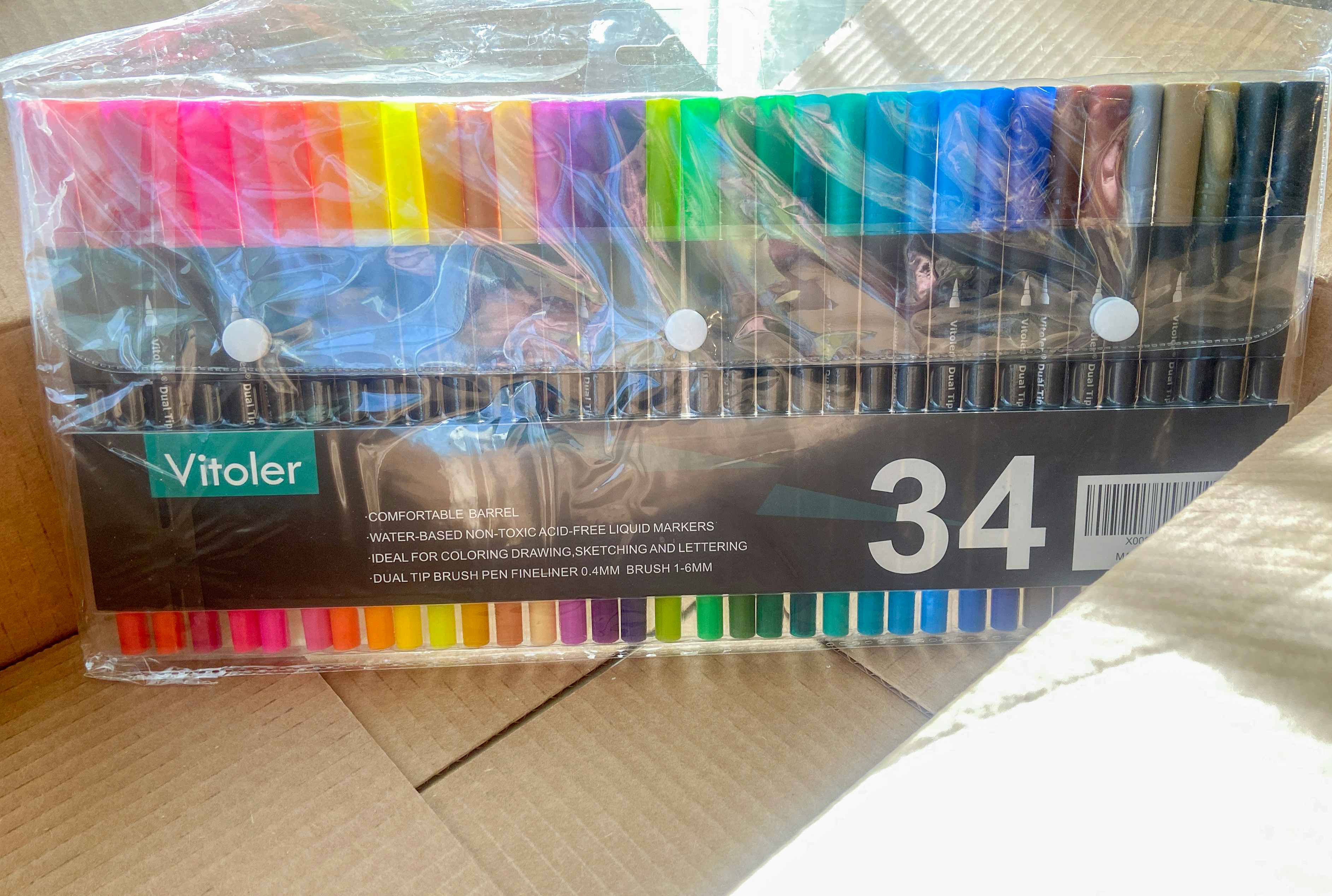 vitoler dual tip colorful marker pens in an amazon box