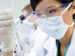 medical researcher or lab technician wearing mask