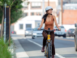 best ebike for the money - person riding velotric e-bike on side of road