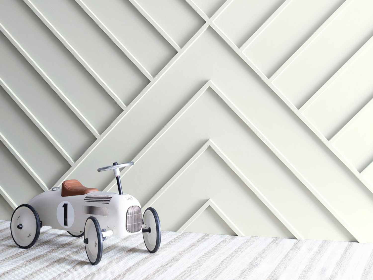benjamin moore winter white painted wall with ride-on toy