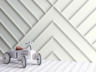 benjamin moore winter white painted wall with ride-on toy