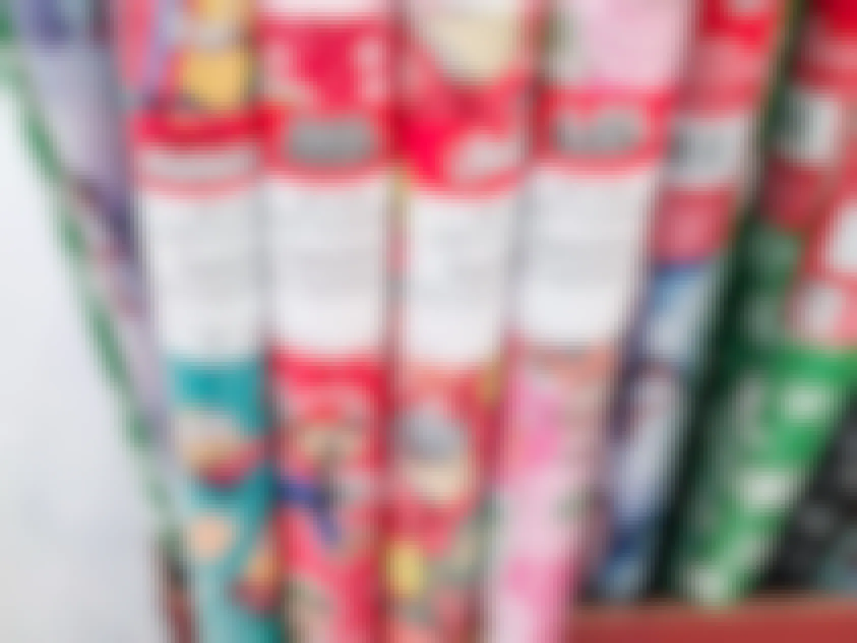 Rolls of licensed character wrapping paper at Dollar Tree 