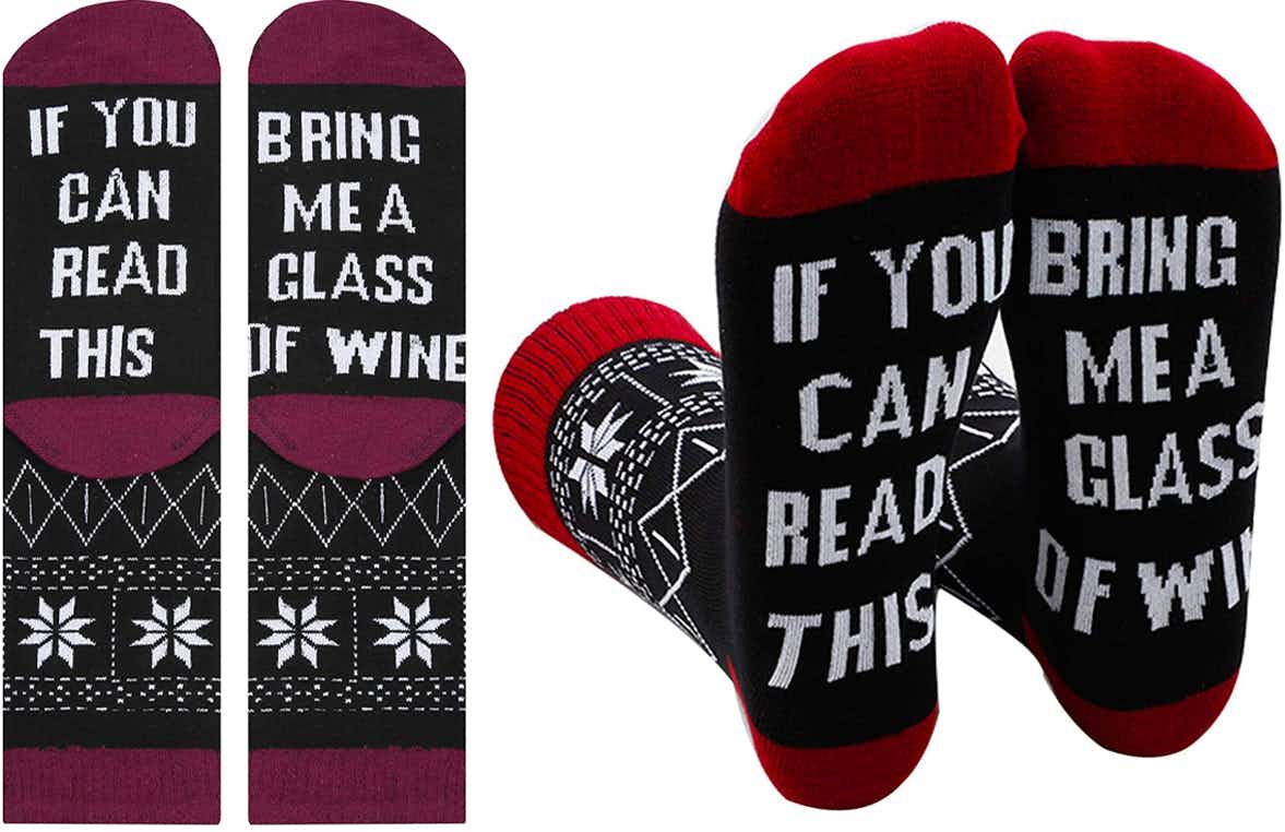 novelty socks with words written on the bottom of the feet "If you can read this bring me a glass of wine