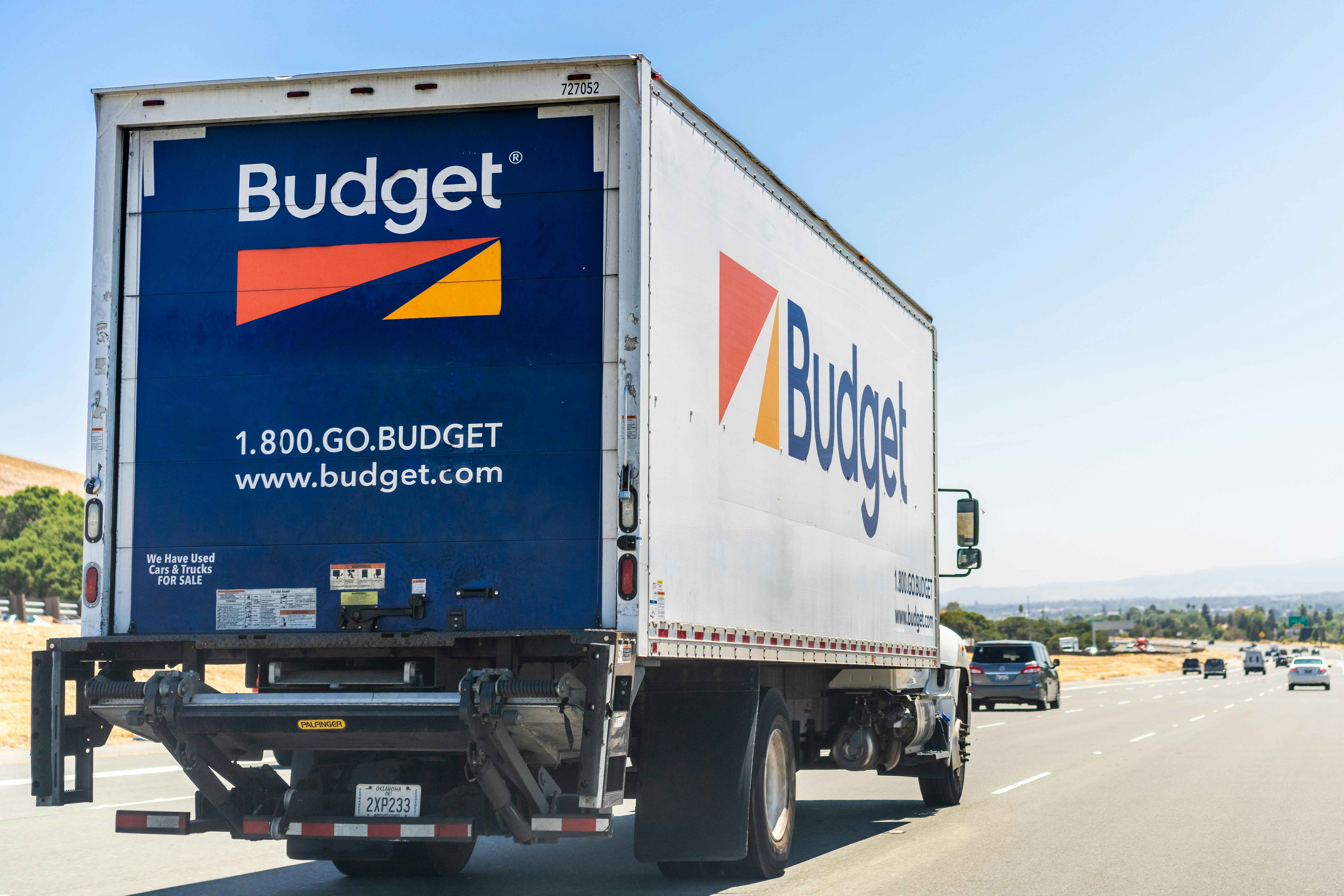 Budget moving truck driving on the freeway