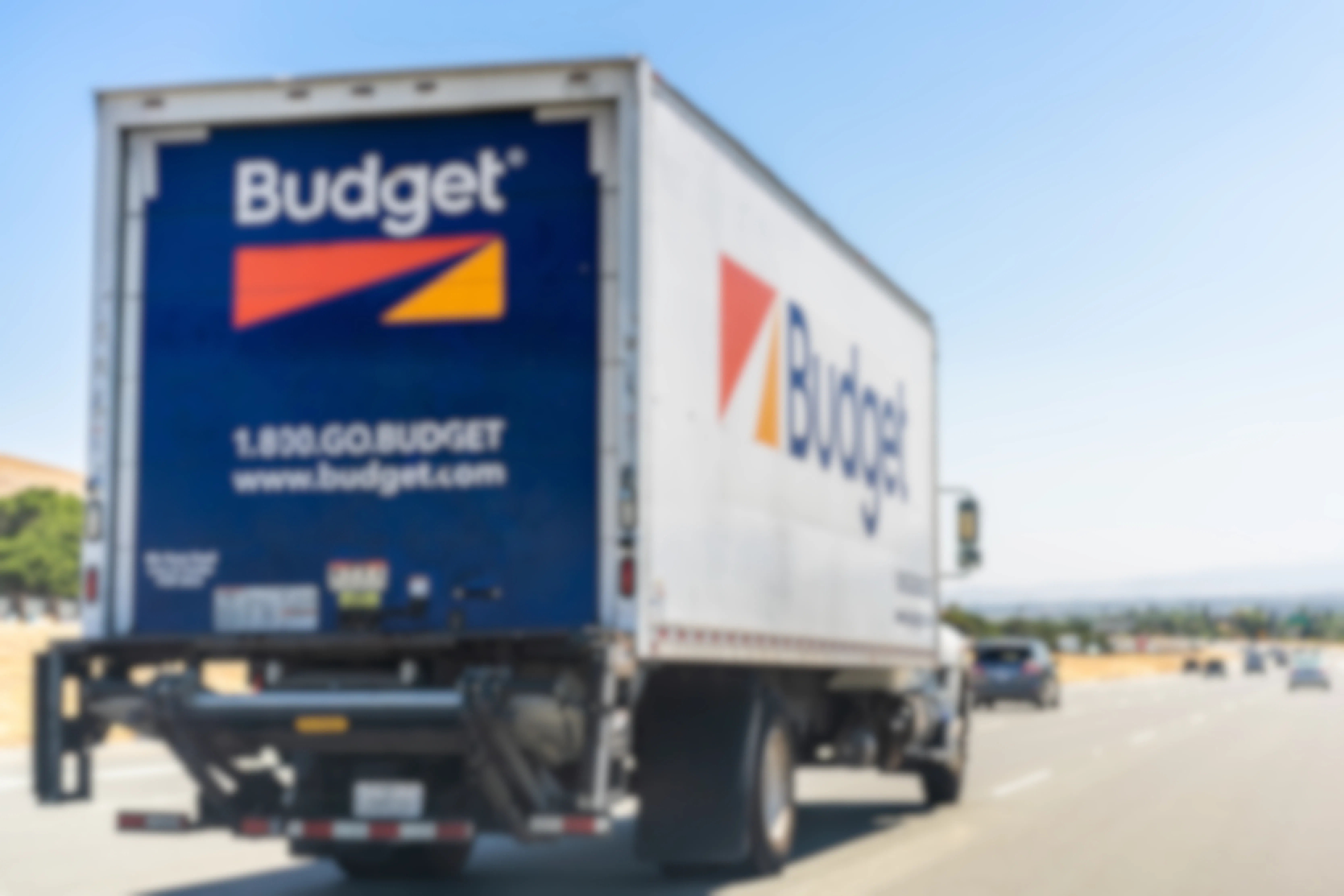 Budget moving truck driving on the freeway
