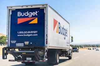 Budget moving truck driving on the freeway