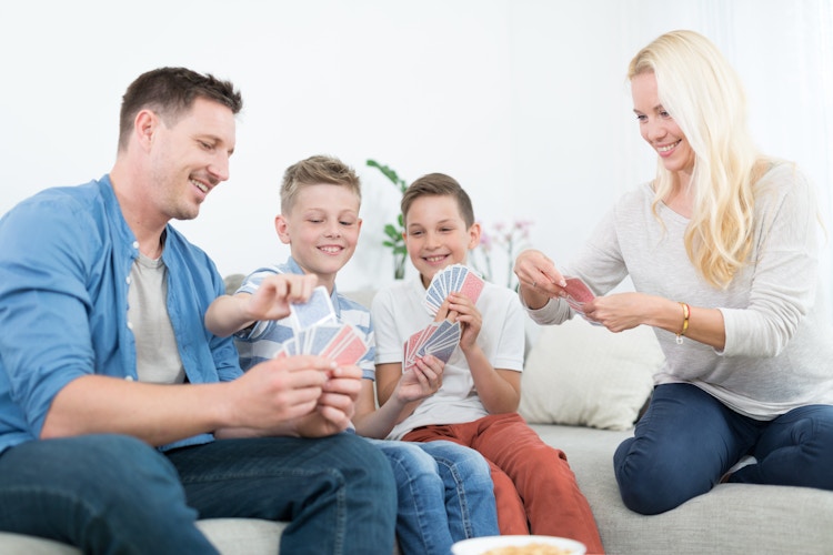 Family playing a card game